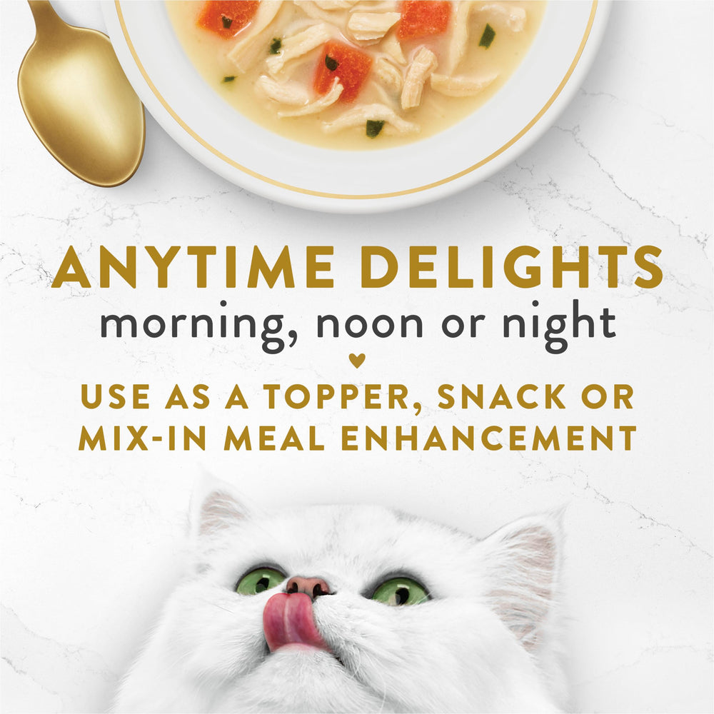 Fancy Feast pouring creamy broth over kibble boosting moisture and flavor