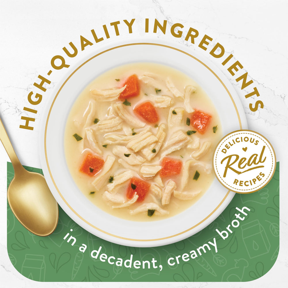 Fancy Feast opened pouch with creamy broth and chicken visible for quick serving