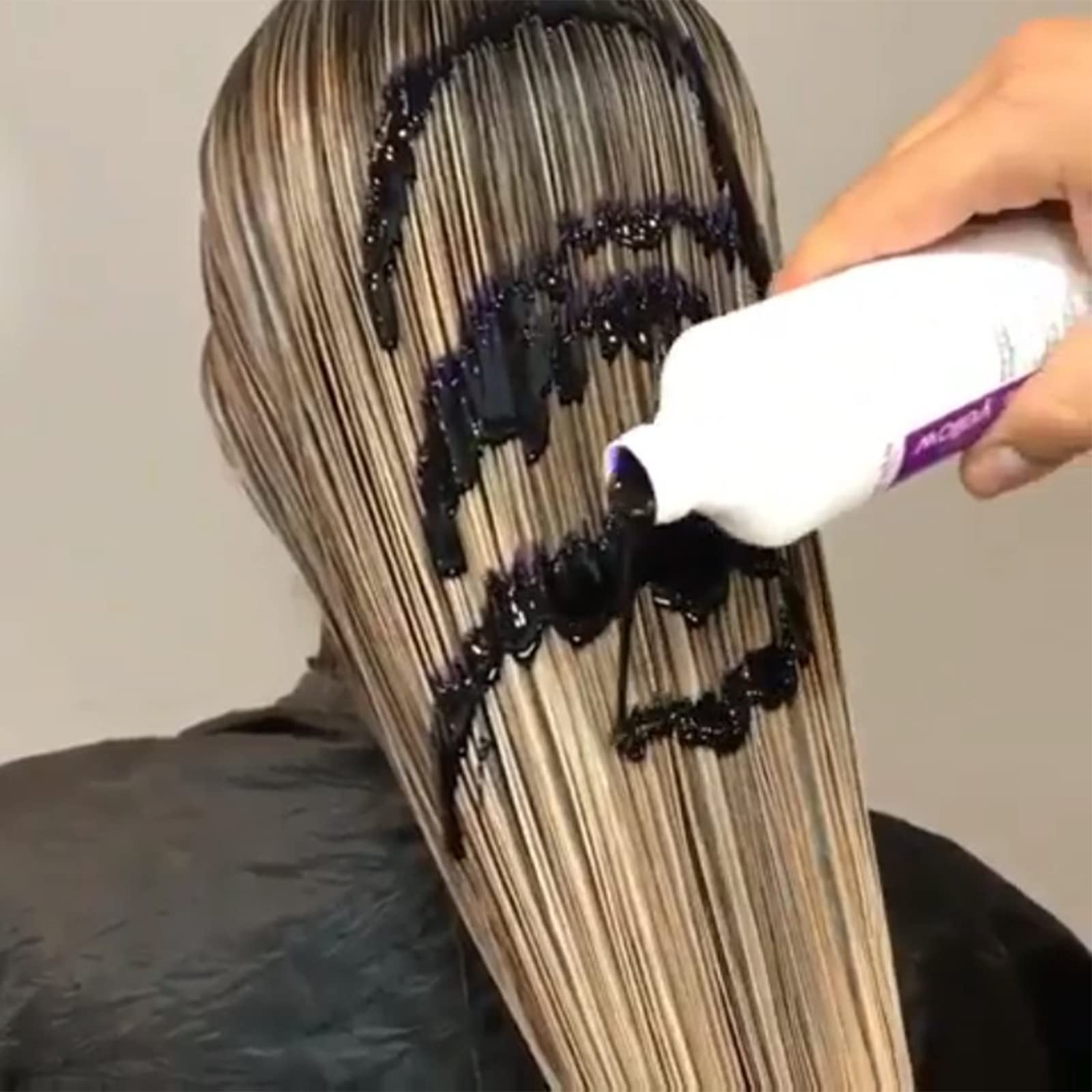 Fanola mask cream texture in hand highlighting conditioning and deposit
