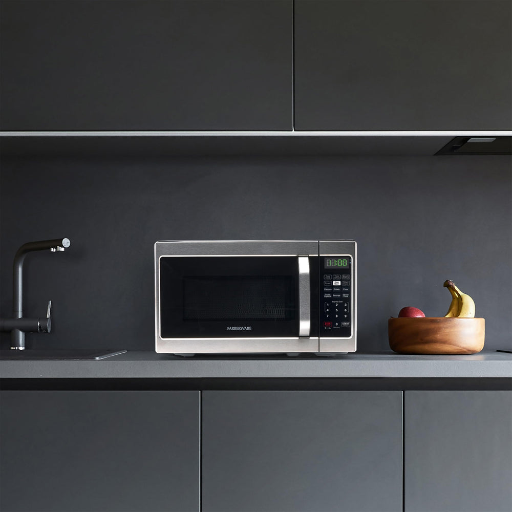Farberware stainless microwave on kitchen counter showing sleek look and space-saving convenience