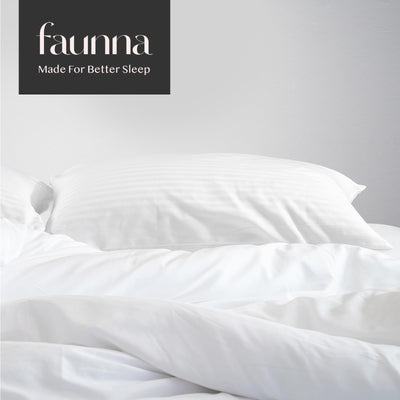 FAUNNA lifestyle on made bed highlighting polished bedding and restful benefit