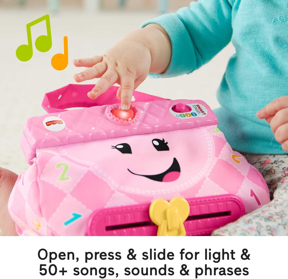 Fisher-Price primer plano de la mano del bebé deslizando la cremallera para practicar motricidad