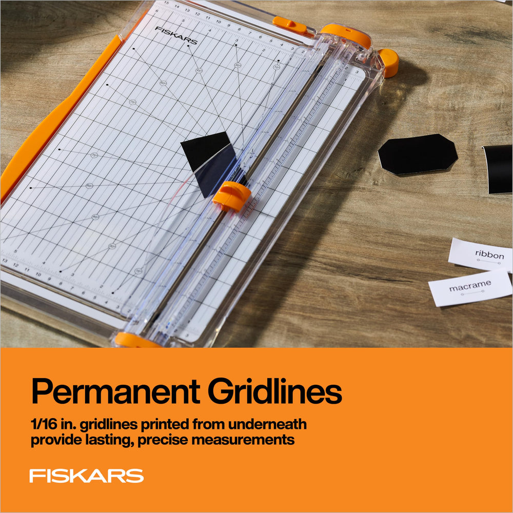 Fiskars extended swing-out arm beside ruler, showing support for large sheets