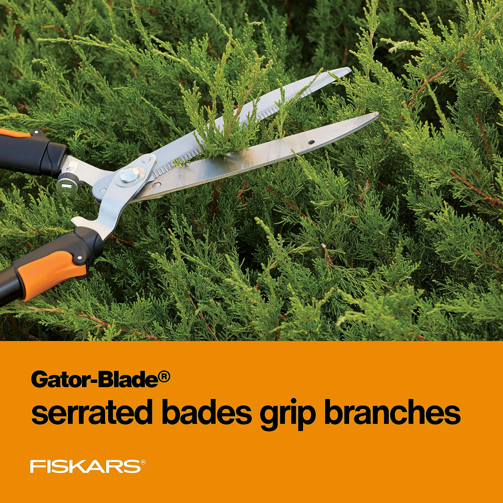 Fiskars shears held extended demonstrating 26–33 inch reach for access