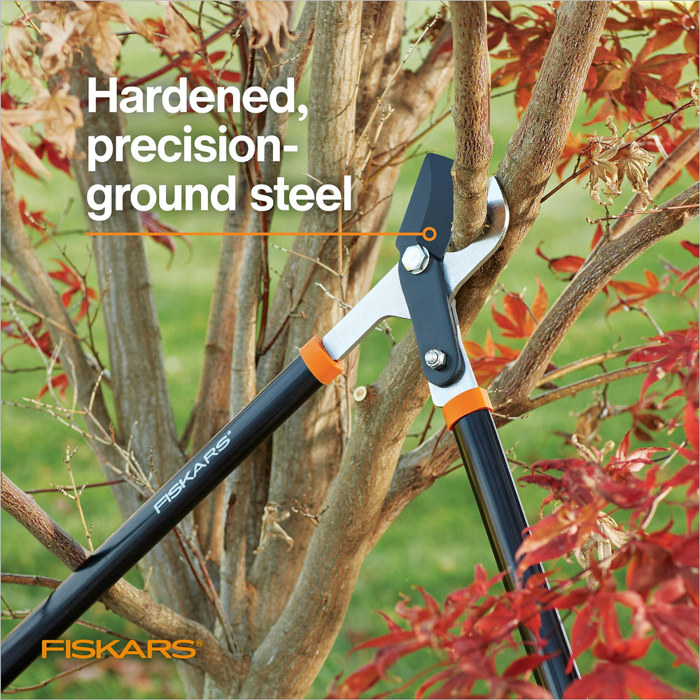 Fiskars lopper beside ruler showing 28-inch length for added leverage
