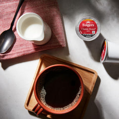 Steaming cup of brewed Folgers coffee close-up, warm aroma and smooth flavor