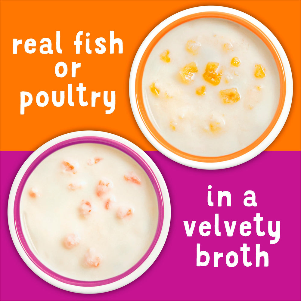 Friskies opened cup showing velvety seafood broth and tender pieces