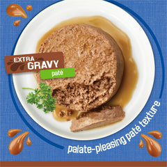 Friskies close-up of gravy sheen on pate highlighting moist texture cats enjoy