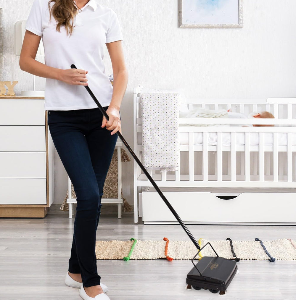 Fuller Brush beside a sneaker showing scale and lightweight portability for small spaces