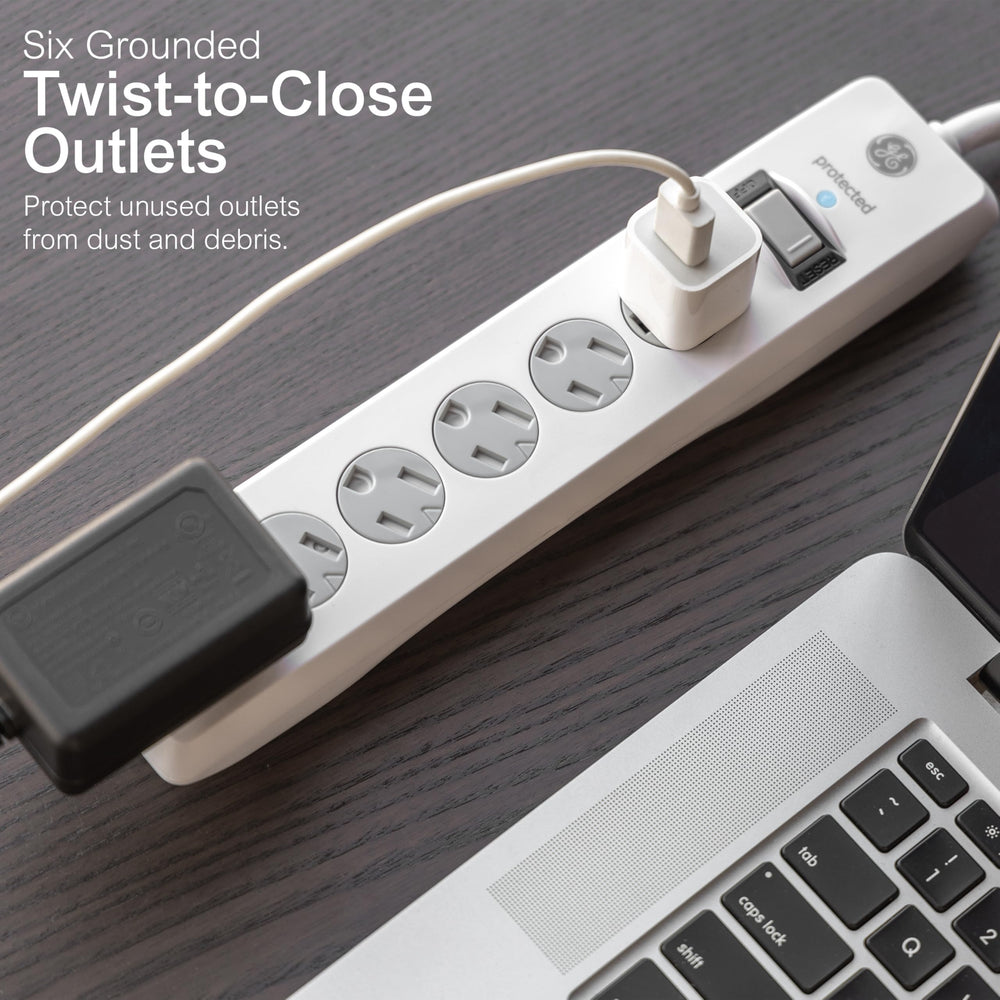 GE flat plug positioned behind furniture demonstrating space-saving benefit
