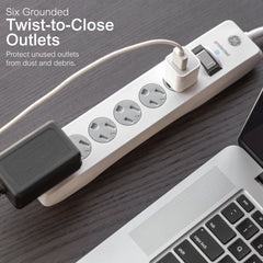 GE flat plug positioned behind furniture demonstrating space-saving benefit