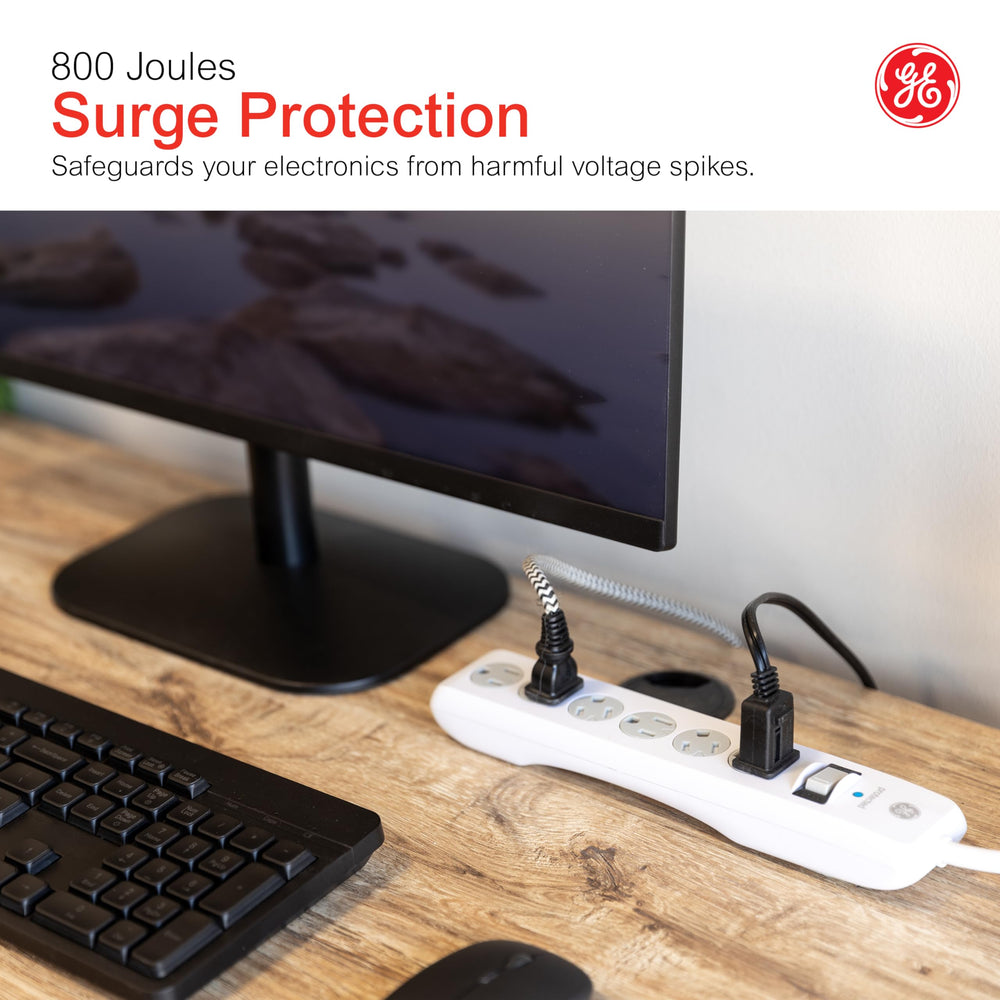 GE surge protector on desk powering devices for organized, protected setup