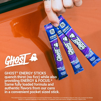 Person sipping GHOST Welch's Grape outdoors showing energy and lifestyle boost