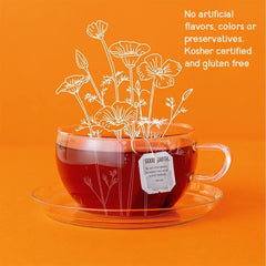Good Earth Tea Co. presentación con manzana y especias mostrando notas dulces y cálidas