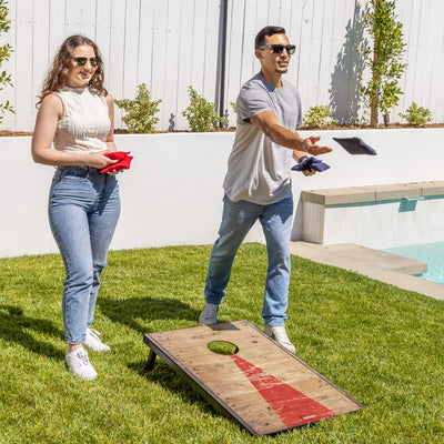 GoSports lifestyle scene of backyard cornhole game encouraging social outdoor fun