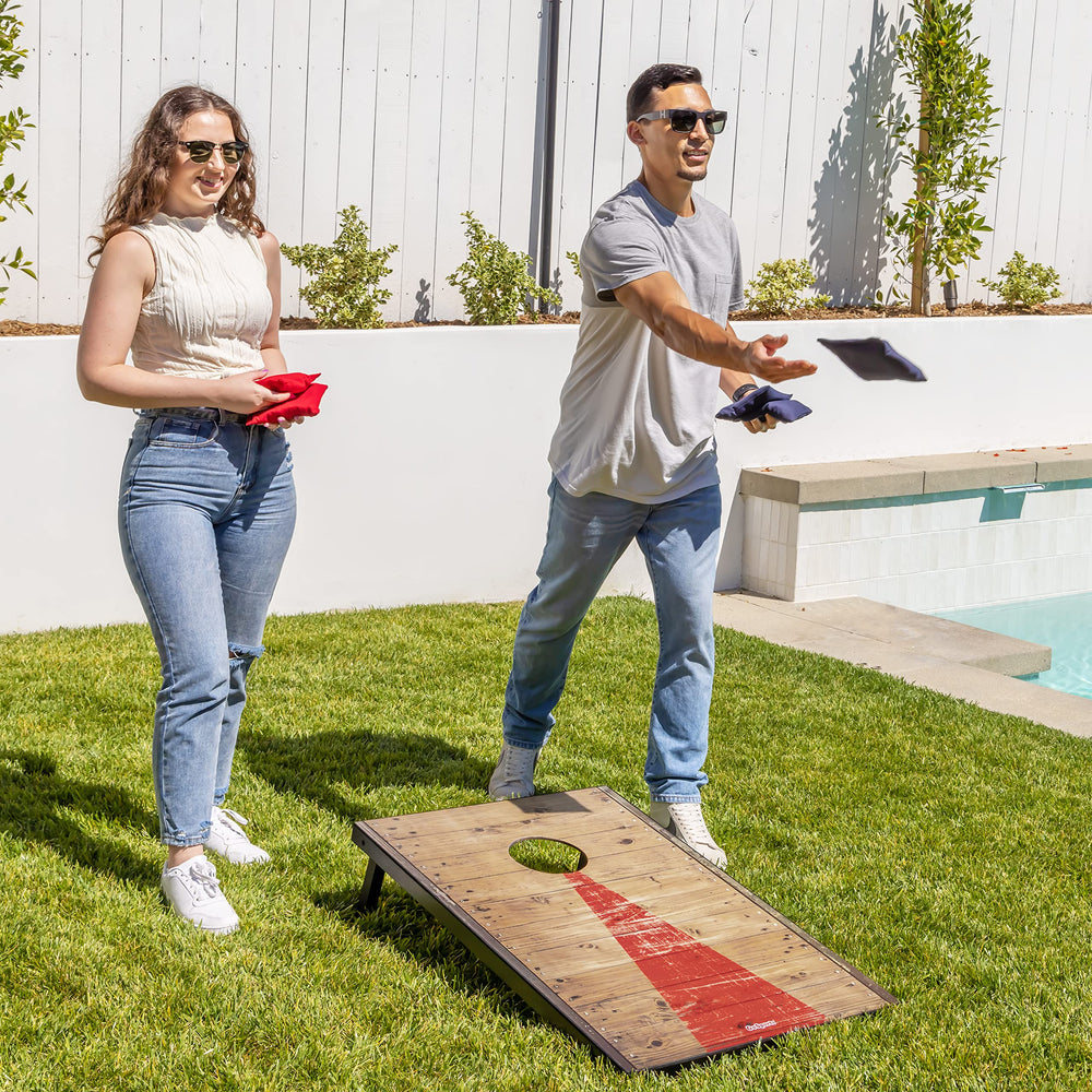 GoSports lifestyle scene of backyard cornhole game encouraging social outdoor fun