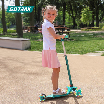 Gotrax KS1 child riding on sidewalk showcasing smooth ride and balance learning