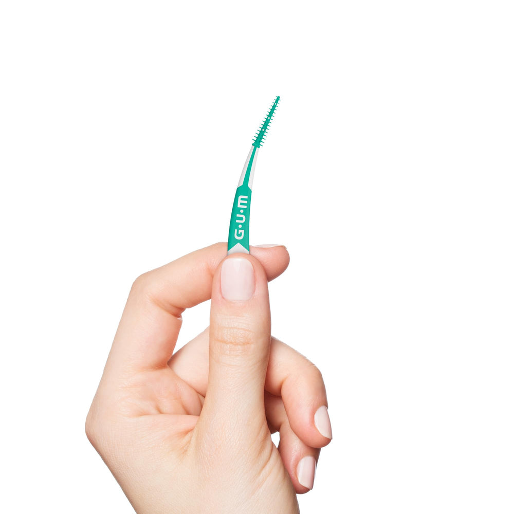 GUM soft picks next to ruler showing compact size for travel