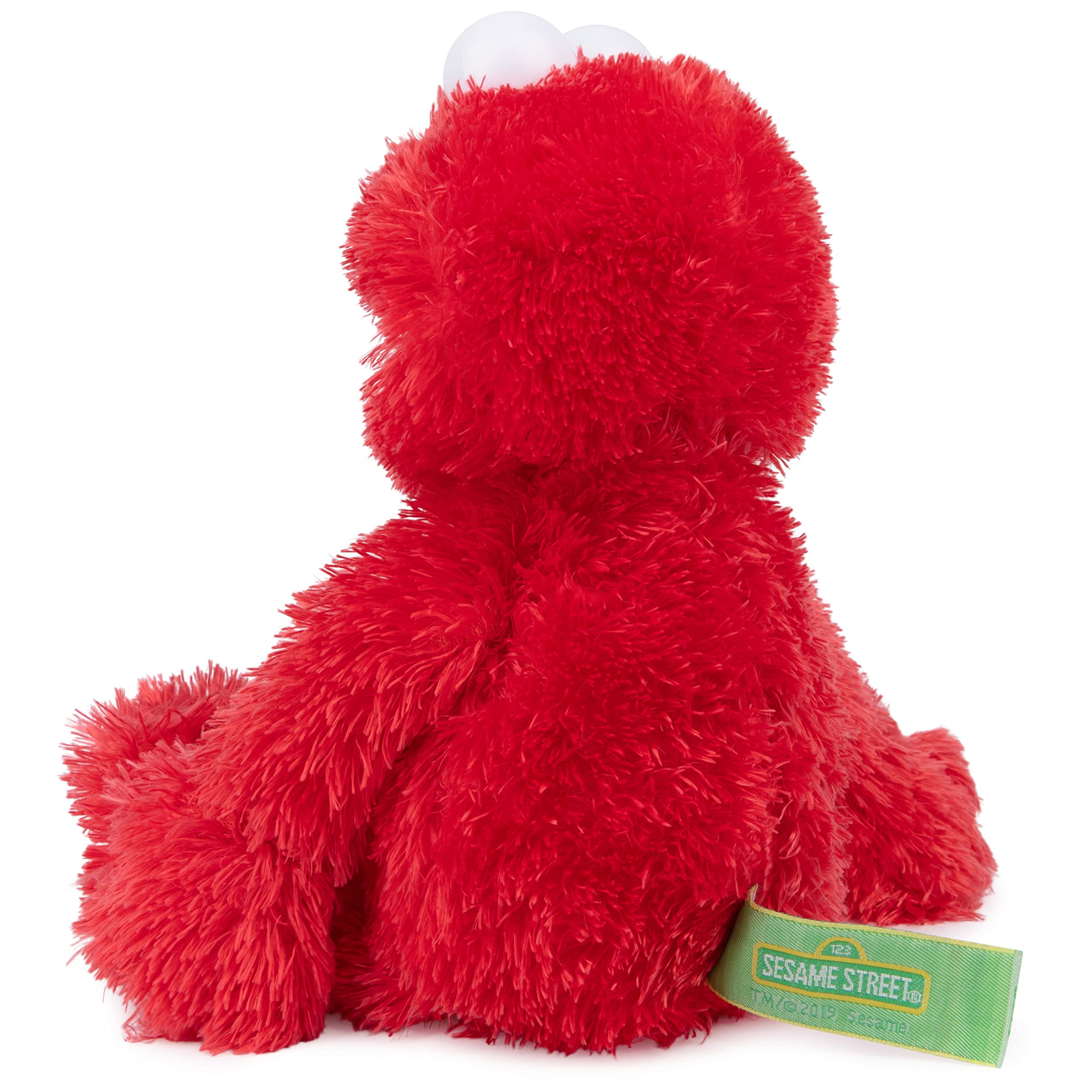 GUND Elmo abrazado por niño que muestra confort y compañía
