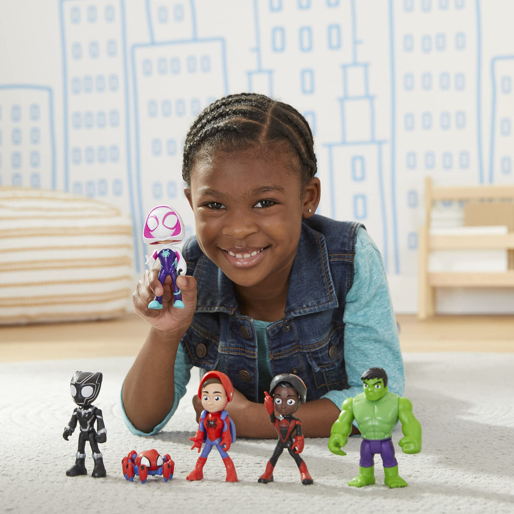 Hasbro figures held in a child’s hand showing scale and safe size