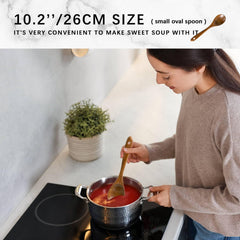 Hefild wooden spoon stirring saucepan showing gentle pan protection and control