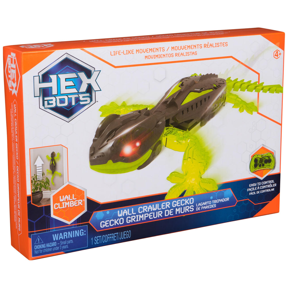 HEX BOTS gecko junto a una mano para comparar tamaño y escala