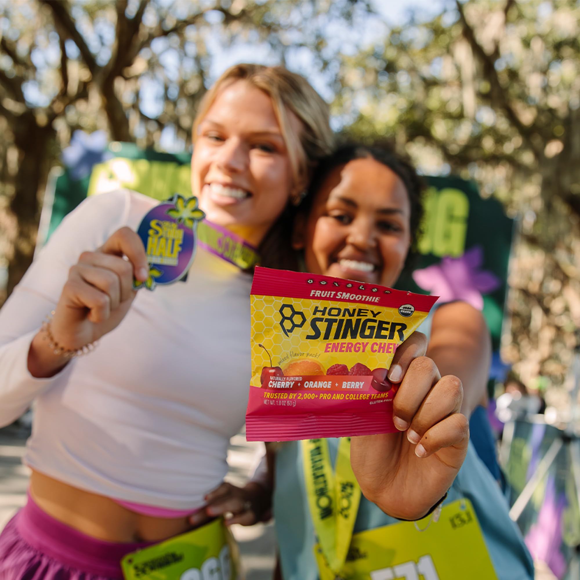 Honey Stinger athlete taking a chew while running for midworkout energy