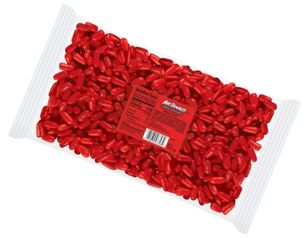 Hot TAMALES mano sosteniendo varios caramelos para mostrar tamaño por porción