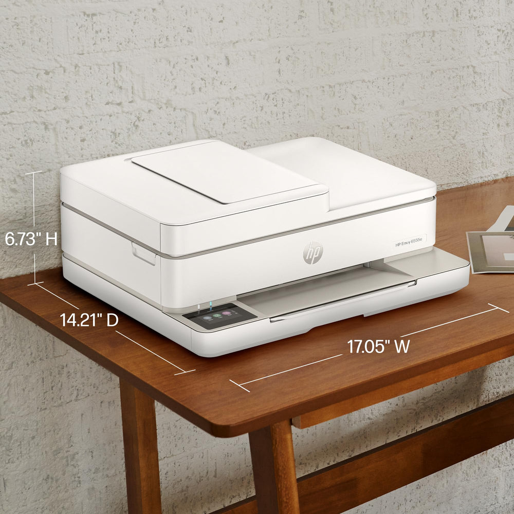 HP Envy 6555e setup with smartphone showing HP Smart app mobile printing benefit