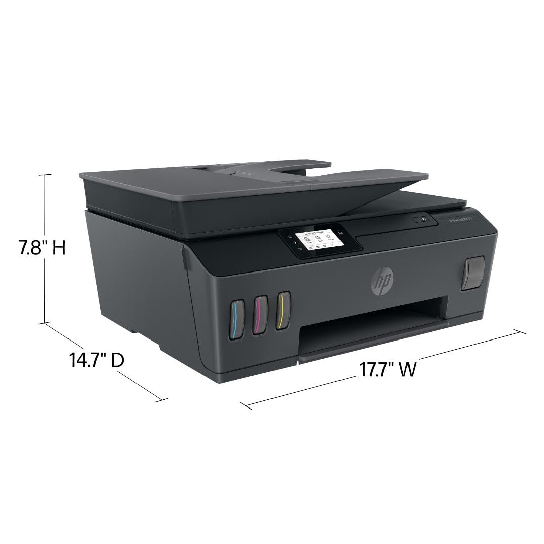 HP Smart Tank Plus 570 output tray with freshly printed color pages demonstrating vibrant prints