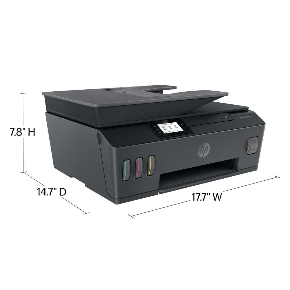 HP Smart Tank Plus 570 output tray with freshly printed color pages demonstrating vibrant prints