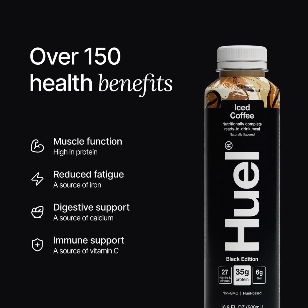 Hand holding Huel bottle demonstrating portability and on-the-go nutrition