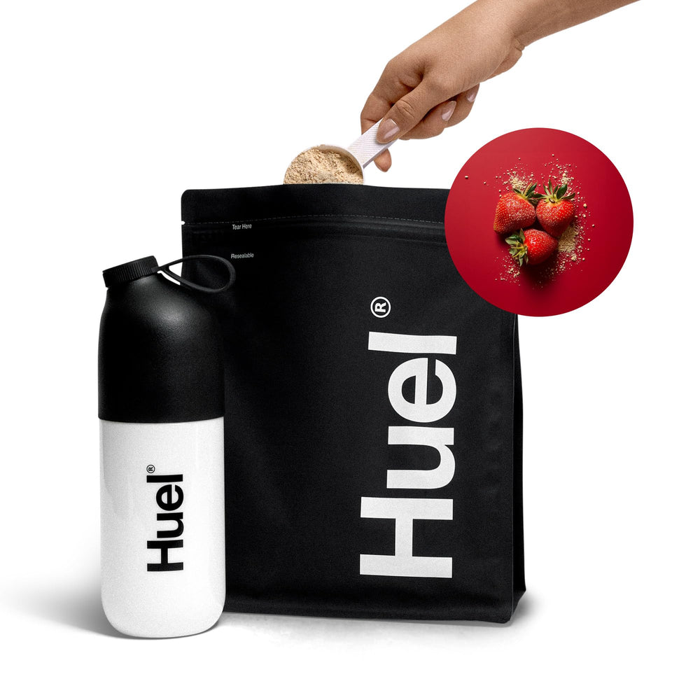 Person carrying Huel Black Edition shake on-the-go for busy lifestyles