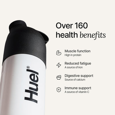 Huel Black Edition strawberry shake in glass ready to drink, convenient nutrition