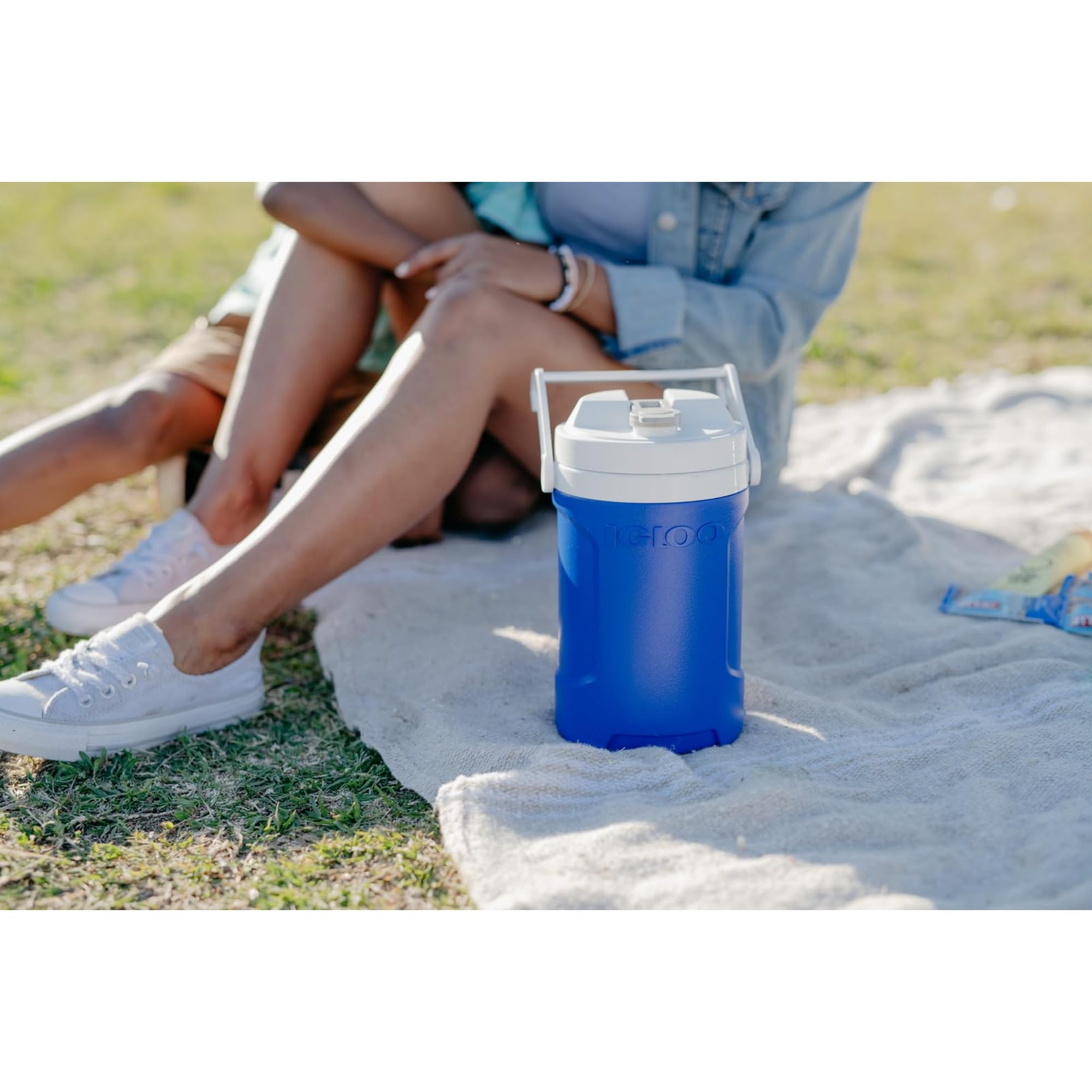 Igloo in use with athlete drinking offering convenient on-field hydration