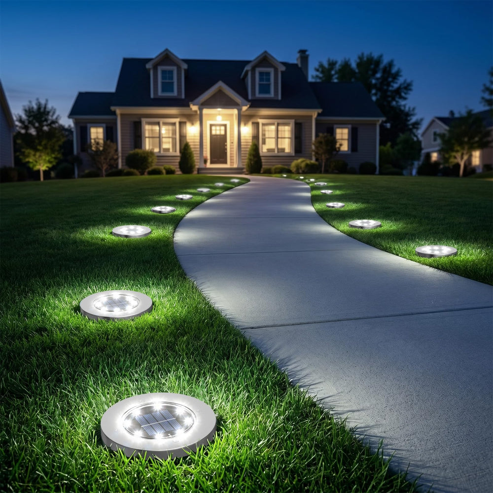INCX installed pathway lights outlining a garden path to improve safety and nighttime visibility