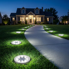INCX installed pathway lights outlining a garden path to improve safety and nighttime visibility