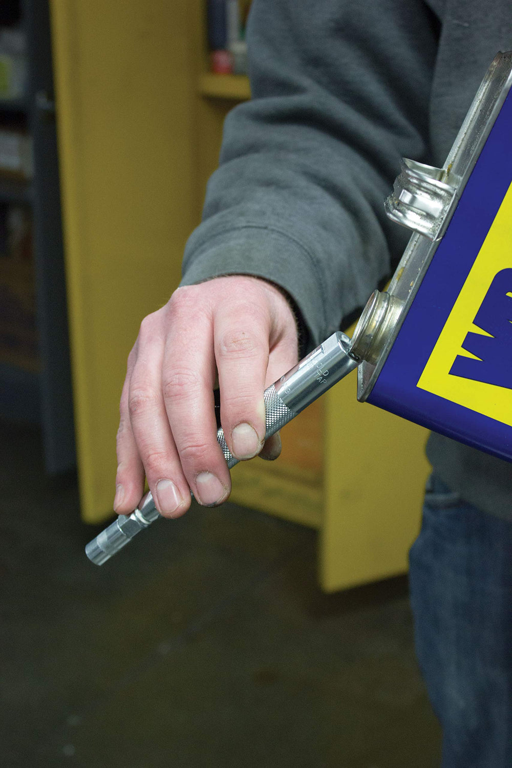Innovative Products of America kit next to a hand for size comparison showing portable, workshop-ready convenience