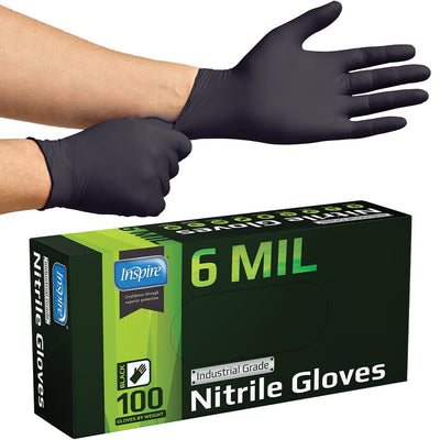 Inspire gloves on mechanic at workbench, protecting hands during repairs benefit