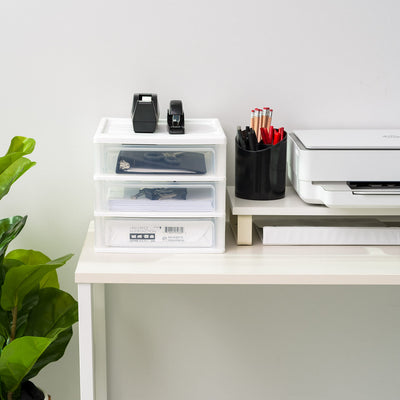 IRIS USA organizer beside a notebook to show compact size and scale