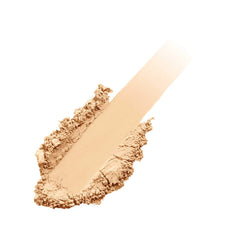 jane iredale recarga junto a una moneda para comparar tamaño y duración portátil