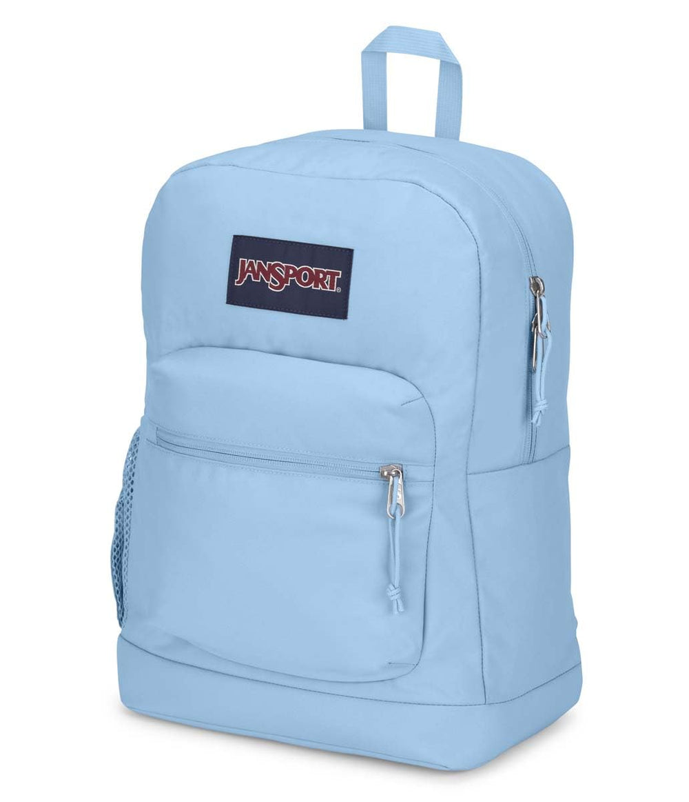 JanSport Cross Town Plus on commuter wearing the pack to show urban use and functional style