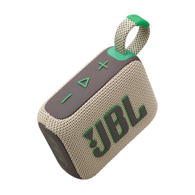 JBL Go 4 on poolside towel demonstrating waterproof use and worry-free sound