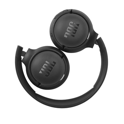JBL Tune 510BT on commuter using public transit highlighting reliable wireless audio