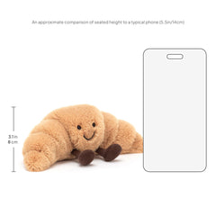Jellycat croissant primer plano de tejido que resalta la suavidad
