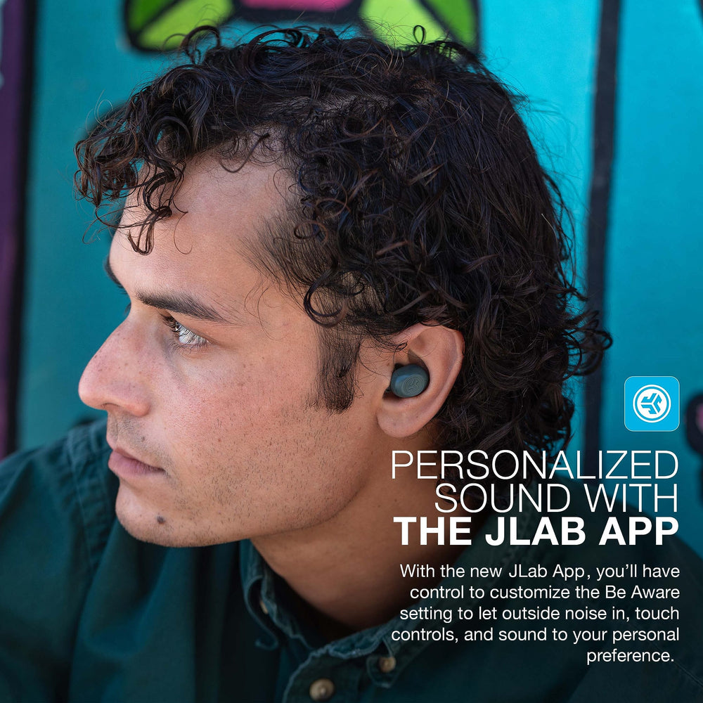 JLab JBuds Mini held in hand for scale - tiny lightweight earbuds for comfort