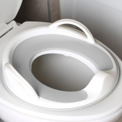 Jool Baby front view of gray potty seat showing secure design and comfy rim