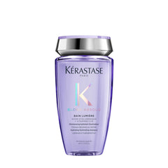 KÉRASTASE botella frontal del champú Blond Absolu mostrando diseño y beneficio brillo