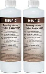 Keurig botella delantera 28 oz mostrando etiqueta y beneficio de limpieza