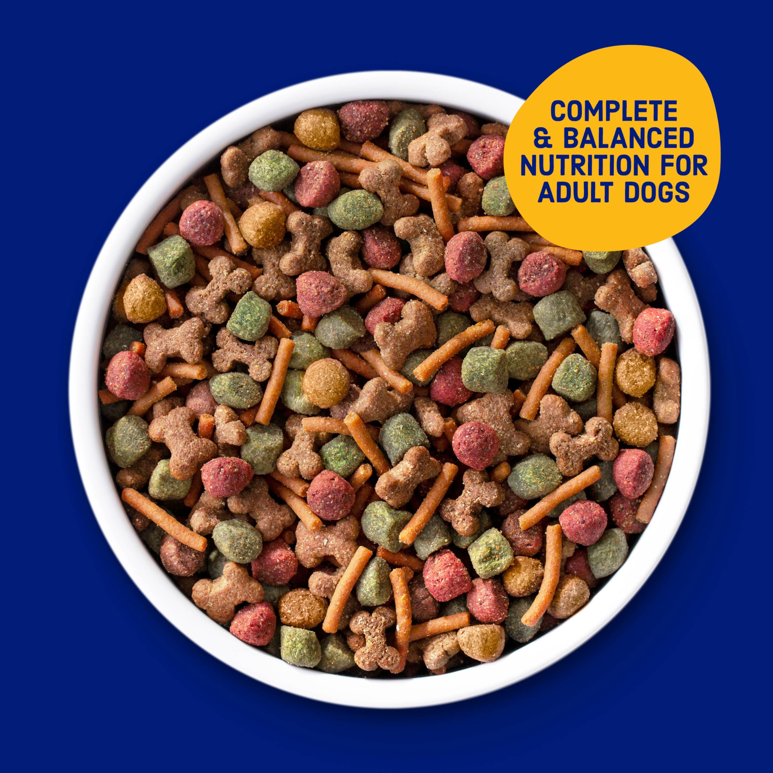 Kibbles 'n Bits 31 lb bag beside a scale showing large bulk size benefit